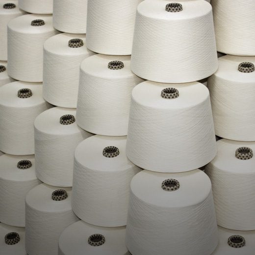 Raw white polyester yarn cones